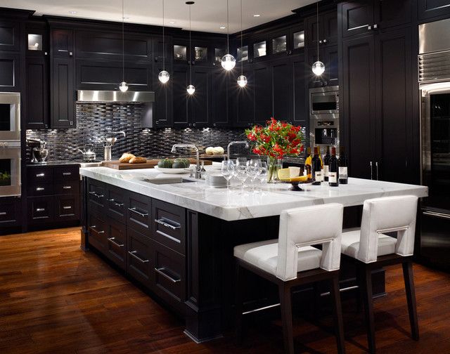 All dark with no natural light creates a very impersonal feeling in this kitchen. 