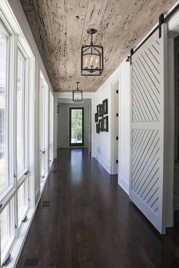 That ceiling and the lighting give you no choice but to look up... except that barn door and the wall of windows