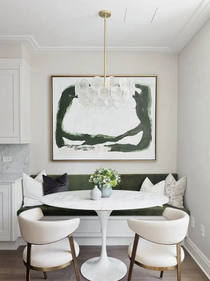 A green and white breakfast nook 