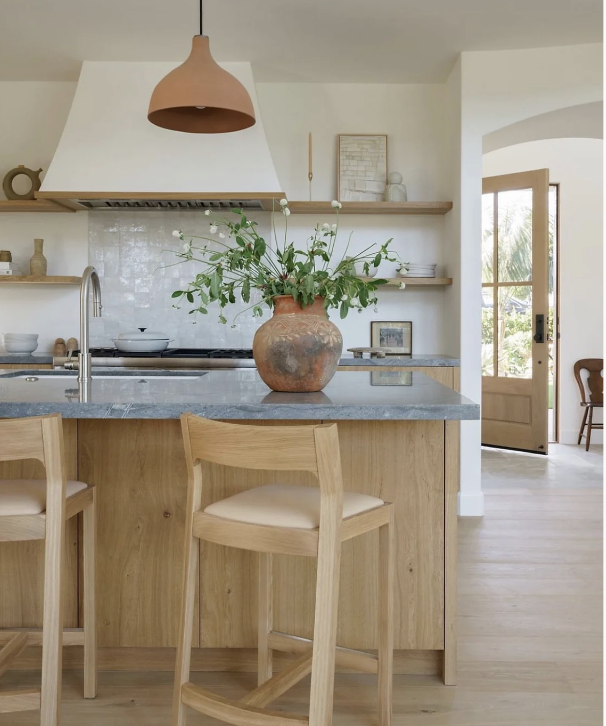 Image Suggestion: A kitchen with reclaimed wood cabinets and a  countertop. Sustainable materials create an organic modern kitchen.
