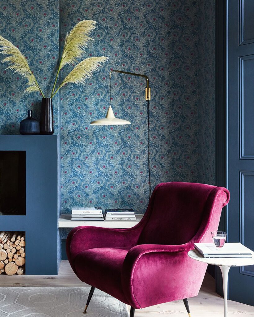 An elegant living room with an accent wall featuring a bold, geometric wallpaper design Davidson custom home design and remodel