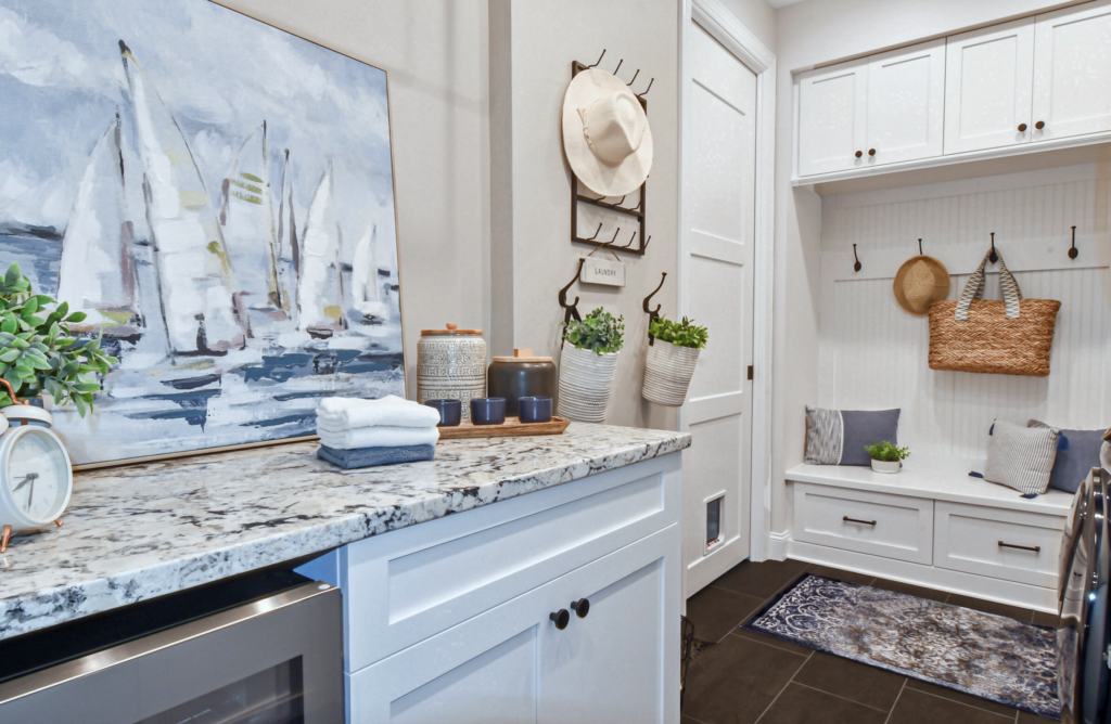 A laundry room with a drop zone adds multifuction purpose to this space created by Sutton Place Interior Design a design and build firm in Cornelius NC 