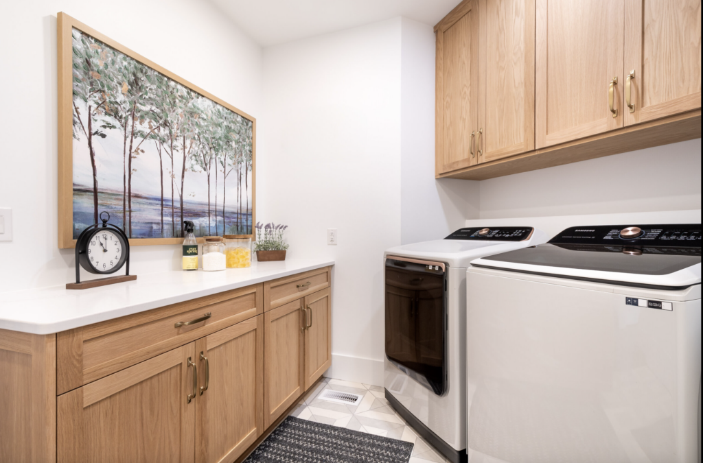 By changing the layout and adding cabinets the laundry room becomes more functional. 